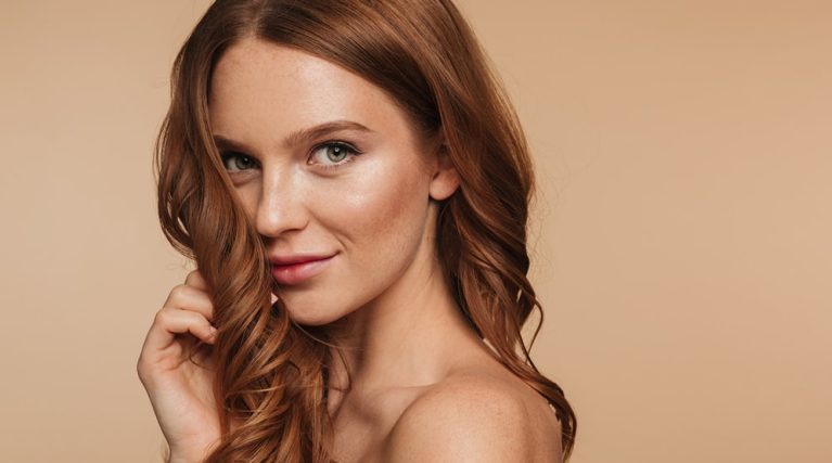 beauty-portrait-mystery-smiling-ginger-woman-with-long-hair-posing-sideways-looking-min beauty-portrait-mystery-smiling-ginger-woman-with-long-hair-posing-sideways-looking-min